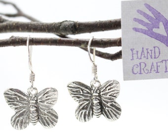 Monarch Butterfly stamped sterling silver earrings. Dangle, drop earrings.Sterling ear wires.