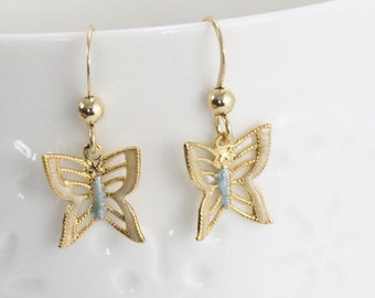 Handcrafted butterfly dangle earrings. Filagree, dapped wings blue enamel over 14Kt gold-filled. Nature inspired