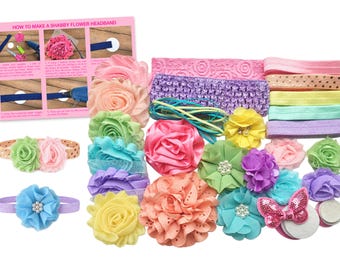 May include: A DIY headband kit featuring various fabric flowers in pink, peach, yellow, green, blue, and purple, along with elastic bands, lace strips, ribbons, and felt circles. Includes an instructional card titled HOW TO MAKE A SHABBY FLOWER HEADBAND.