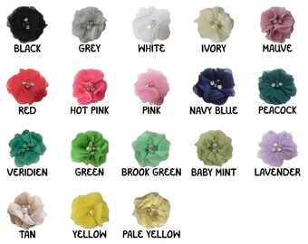 May include: Assortment of 15 fabric flower hair clips in various colors, including black, grey, white, ivory, mauve, red, hot pink, pink, navy blue, peacock, veridien, green, brook green, baby mint, lavender, tan, yellow, and pale yellow.