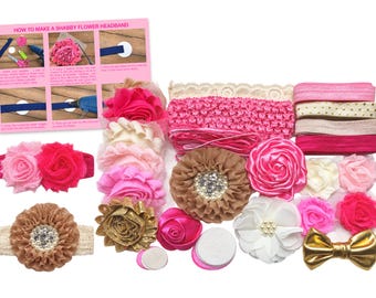 May include: A DIY headband making kit featuring various fabric flowers in shades of pink, white, and gold, elastic bands, felt circles, and a gold bow. An instructional card titled HOW TO MAKE A SHABBY FLOWER HEADBAND is included with step-by-step images.