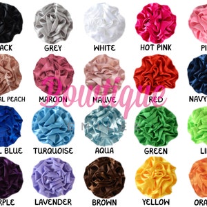 May include: A collection of 20 satin fabric flower embellishments in various colors, including black, grey, white, hot pink, pink, tropical peach, maroon, mauve, red, navy blue, royal blue, turquoise, aqua, green, lime, purple, lavender, brown, yellow, and orange.