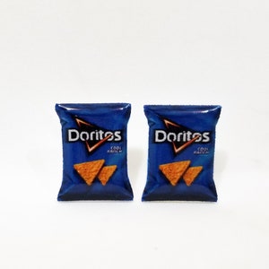 May include: Two miniature bags of Doritos Cool Ranch tortilla chips. The bags are blue with the Doritos logo and a picture of chips.
