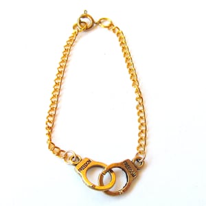 Handcuff freedom bracelet (tibetan charm, gold, friendship bracelet,bff,partners in crime)