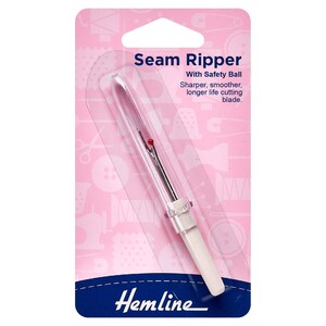 May include: A seam ripper in a clear plastic package. The package is pink with sewing-themed illustrations. The seam ripper has a white handle and a silver blade with a red safety ball. Text on the package reads "Seam Ripper" and "Hemline."