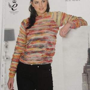 May include: A knitted sweater in a variety of colours, with the text "bamboozle" and measurements of 71/76 - 112/117 cm. The sweater features a high neck and long sleeves. The image also includes the text "King Cole" and "THE QUEEN'S AWARDS FOR ENTERPRISE 2012".