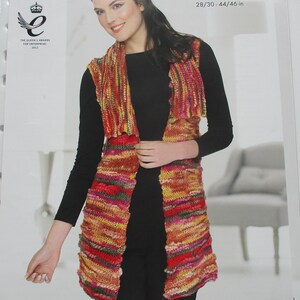 May include: A woman modelling a knitted vest in shades of red, yellow, and green. The vest has a textured, striped design and is open at the front. The image includes the word "bamboozle" and measurements of 71/76-112/117 cm and 28/30-44/46 in.