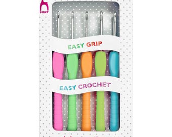 May include: A pack of six crochet hooks with brightly coloured handles in pink, green, orange, and blue. The hooks are silver and are packaged in a white box with the text "EASY GRIP" and "EASY CROCHET". The brand logo is a pink pony.