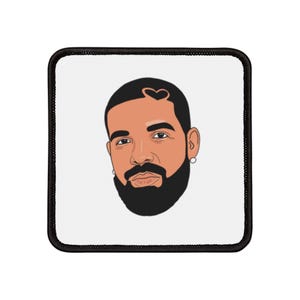 Op de afbeelding: Een zwart-witte cartoonillustratie van een man met een baard en een hartvormig kapsel. De man kijkt rechtstreeks naar de kijker.