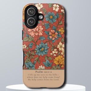 May include: A phone case featuring a floral design with blue, peach, and yellow flowers on a red background. The bottom section is tan with the text "Psalm 121:1-2" and a Bible verse.