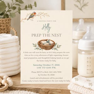 Peut inclure: Une carte d'invitation crème pour une fête de préparation de nid pour Holly, avec un oiseau aquarelle sur une branche et un panier avec un cadeau. Le texte inclut les détails de l'événement, la date du 17 octobre 2026 et les informations RSVP.
