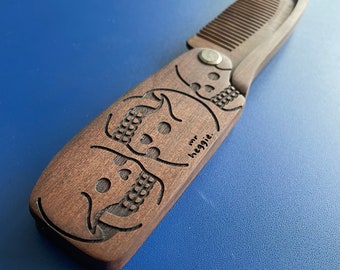 Wooden flick comb featuring designs by the great Mr. Heggie and awesome Lozzy Bones