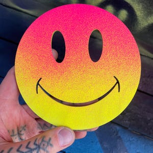 Hand painted acid style smiley wood art