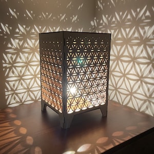 Flower of Life geometric pattern shadow lamp.