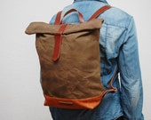 waxed Canvas rucksack/backpack, brown color, hand waxed , with handles, leather base and  closures