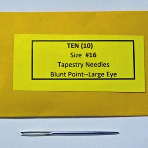 May include: A yellow envelope with a label that reads "TEN (10) Size #16 Tapestry Needles Blunt Point-Large Eye". A single silver tapestry needle is shown below the envelope.