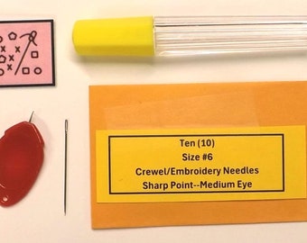 May include: A pack of ten size 6 crewel embroidery needles with a yellow label that reads "Ten (10) Size #6 Crewel/Embroidery Needles Sharp Point--Medium Eye".