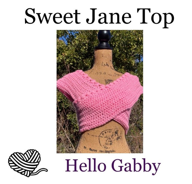 May include: A pink crocheted crop top with a V-neck and short sleeves. The top is on a mannequin and has a criss-cross design in the front. The text "Sweet Jane Top" is at the top of the image and "Hello Gabby" is at the bottom.