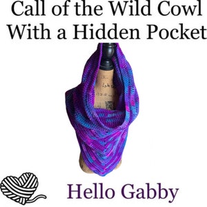 May include: A purple and blue crocheted cowl with a hidden pocket. The cowl is displayed on a wooden mannequin. The text "Call of the Wild Cowl With a Hidden Pocket" and "Hello Gabby" are visible in the image.