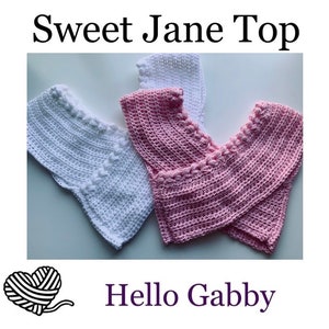 May include: Two crocheted tops, one white and one pink, with a criss-cross design and a braided trim. The tops are laid out on a white surface. The text "Sweet Jane Top" is at the top of the image and "Hello Gabby" is at the bottom.
