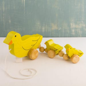 Mr. Ellie Pooh Wooden Pull-Along Duck Family
