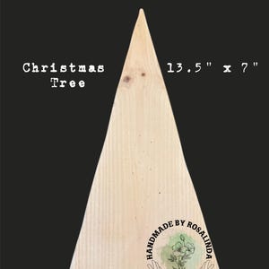 May include: A pine wood Christmas tree-shaped decoration. The light-colored wood is 13.5" x 7" and has the text "Pine Wood" and "Christmas Tree" printed on it. The bottom right corner has a logo that says "Handmade by Rosalinda".