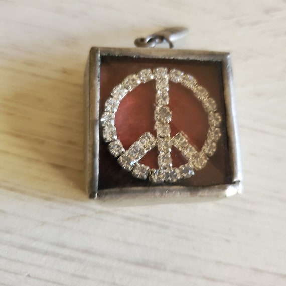 Swarovski peace charm deals