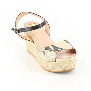 May include: Wedge sandals with a snakeskin print toe strap and a black ankle strap. The platform sole is made of woven material. The sandals have a buckle closure.