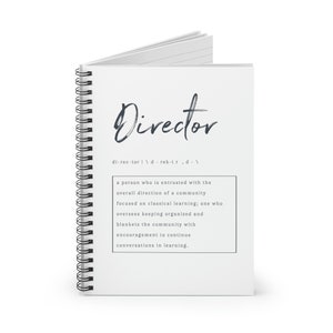 May include: A white spiral bound notebook with the word "Director" written in black script at the top. The definition of the word is written in black text below the word.