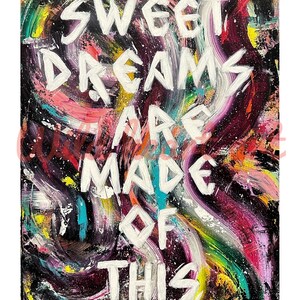 May include: An abstract painting featuring thick, white, hand-painted text that reads "SWEET DREAMS ARE MADE OF THIS" centered over a vibrant, swirling background of black, magenta, yellow, blue, and green paint strokes with white splatter accents.