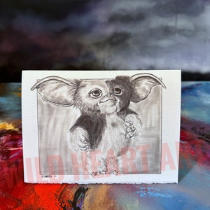 May include: A black and white pencil drawing of a furry creature with large ears, looking up with a curious expression. The drawing is on a white background.