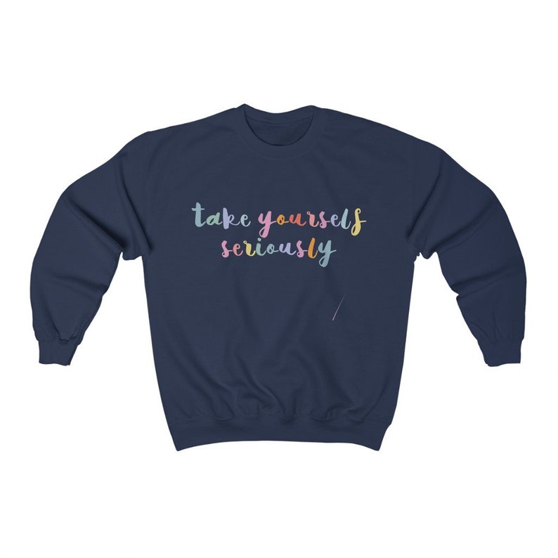 May include: Navy blue sweatshirt with the text "take yourself seriously" in rainbow colors.