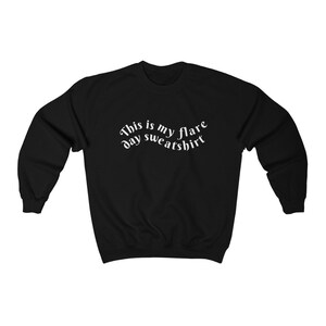 A black sweatshirt that says "This is my flare day sweatshirt"