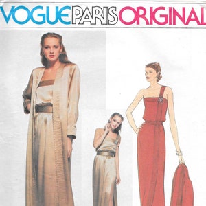 May include: A vintage sewing pattern for a long evening gown with a one-shoulder neckline. The pattern is by Christian Dior and is from Vogue Paris Original. The pattern number is 2127.