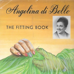 May include: A book cover with the title "Angelina di Bello THE FITTING BOOK" in black text on a yellow background. A woman with dark hair is pictured in a black and white photo in the upper right corner of the cover. The cover also features a hand sewing a green fabric with a needle and thimble.