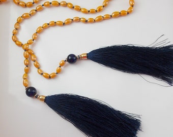 Long necklace to tie in artisanal ceramic beads, customizable color.