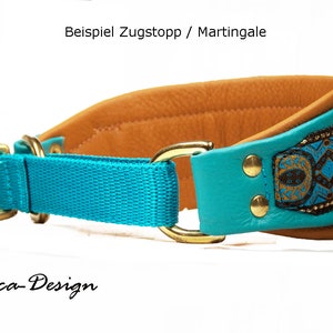 May include: A turquoise blue and brown leather dog collar with a gold metal buckle and a decorative patterned strap. The collar is labeled "Beispiel Zugstopp / Martingale" and "Luca-Design".
