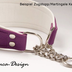 May include: Purple leather dog collar with white lining and a silver chain martingale. The collar has two silver snaps and the text "Beispiel Zugstopp/Martingale Kette" and "Luca-Design" are visible.