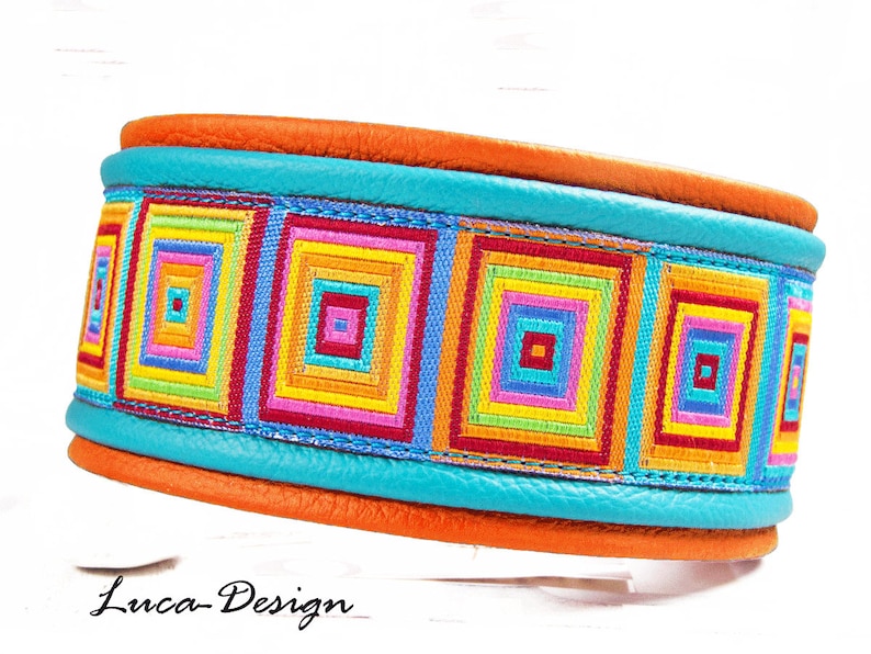 May include: A turquoise leather dog collar with a colorful geometric pattern ribbon. The collar is orange on the inside and has the text "Luca-Design" on the bottom.