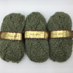 May include: Three skeins of green "lovely sphinx" yarn. The yarn is made in France and is a textured, fuzzy type of yarn.
