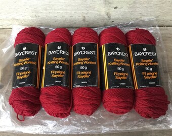 May include: Five skeins of red knitting worsted yarn, each labeled "Baycrest Sayelle Knitting Worsted 50g Fil peigné Sayelle*"
