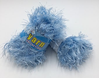 May include: Two skeins of light blue fuzzy yarn. The yarn is labeled "Yarn Collection".