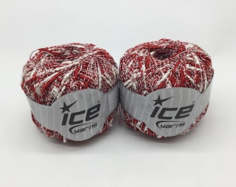 May include: Two balls of red and white yarn with a silver label that reads "Ice Yarns" with a star.