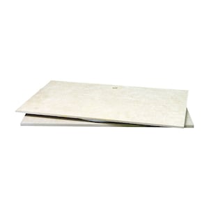 May include: Two beige-colored pieces of fiberboard stacked on top of each other. The top piece has a small hole in the center.