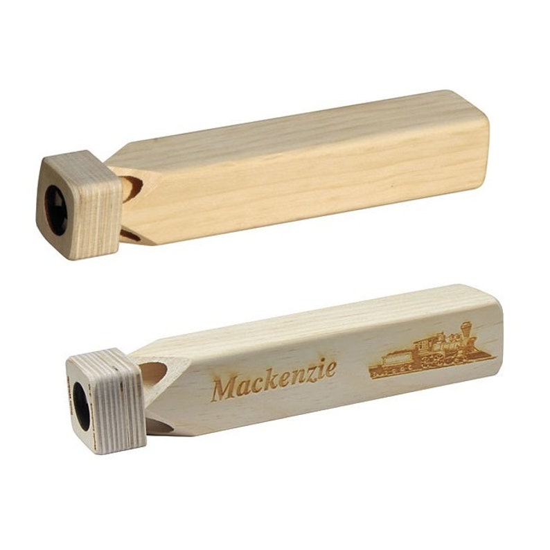 May include: Two wooden whistles, one plain and one with the name "Mackenzie" and a train image engraved on it.