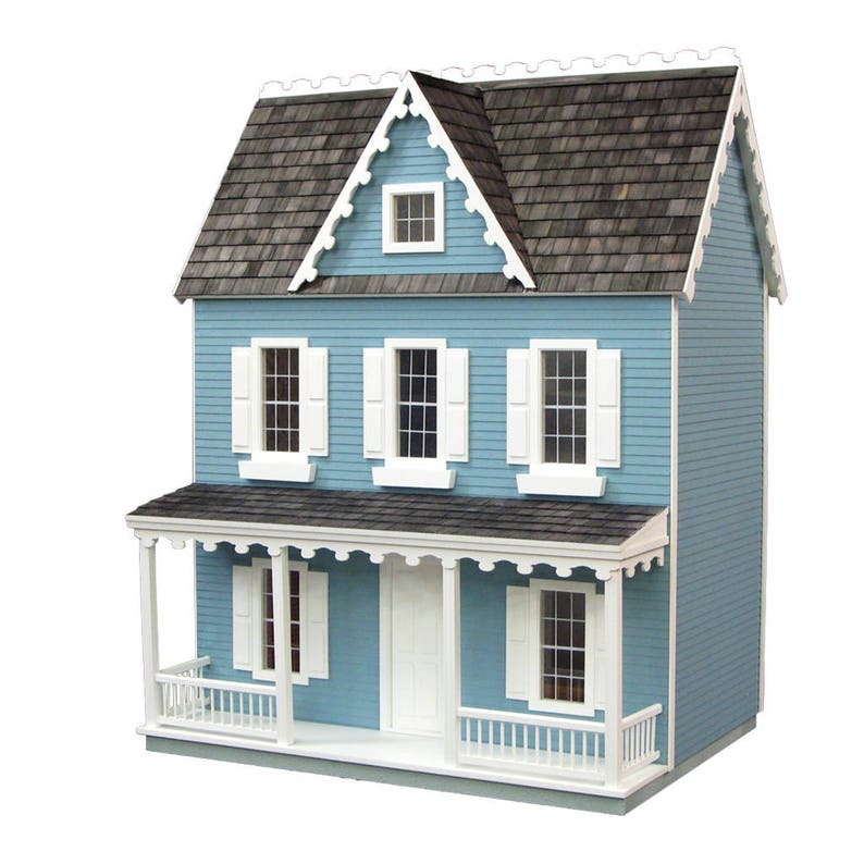 Finished 1-inch scale Vermont Farmhouse Jr. Dollhouse Kit by Real Good Toys. Front view, painted blue with white trim. Milled MDF exterior, front porch, wooden roof shingles, shutters, window boxes. 29.4 in. tall x 24.25 wide. Kit sold unfinished.