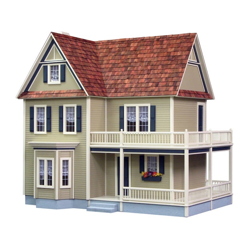 Front view of finished 1 inch scale Victorias Farmhouse Dollhouse Kit by Real Good Toys. 3 story farmhouse 33 in. tall x 34.5 wide. Milled clapboard exterior, wrap around porch, wooden roof shingles. Side opening access. Kit is unfinished.