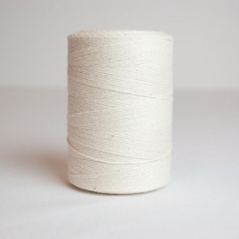 May include: A spool of natural white cotton twine.