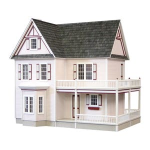 Front view of finished 1 inch scale Victorias Farmhouse Dollhouse Kit by Real Good Toys. 3 story farmhouse 33 in. tall x 34.5 wide. Milled clapboard exterior, wrap around porch, wooden roof shingles. Side opening access. Kit is unfinished.