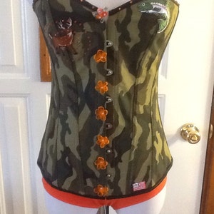 Hunter girl camo corset with hunter orange panties. Celebrate meat in the locker! Perfect for Christmas!